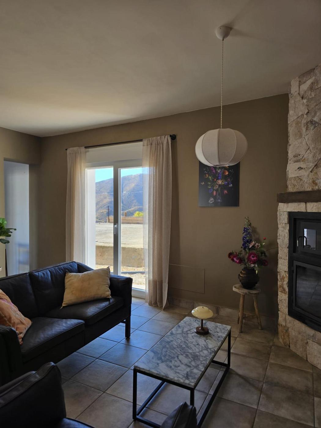 Living room with stone fireplace